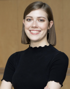 A woman with short hair smiling. 